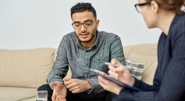 A man in a counselling session