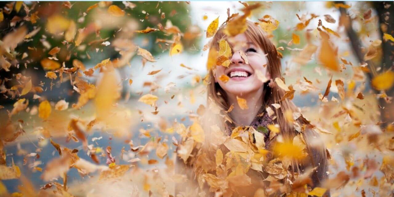 pic of girl with autumn leaves