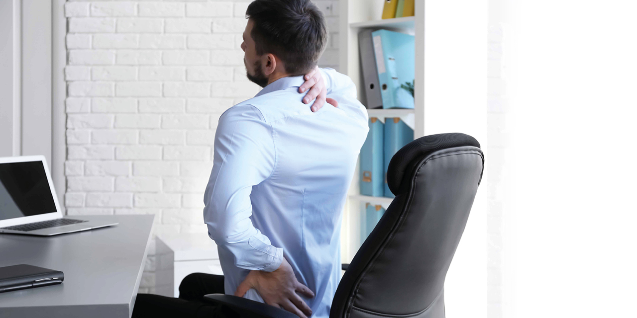 pic of man sitting at a desk