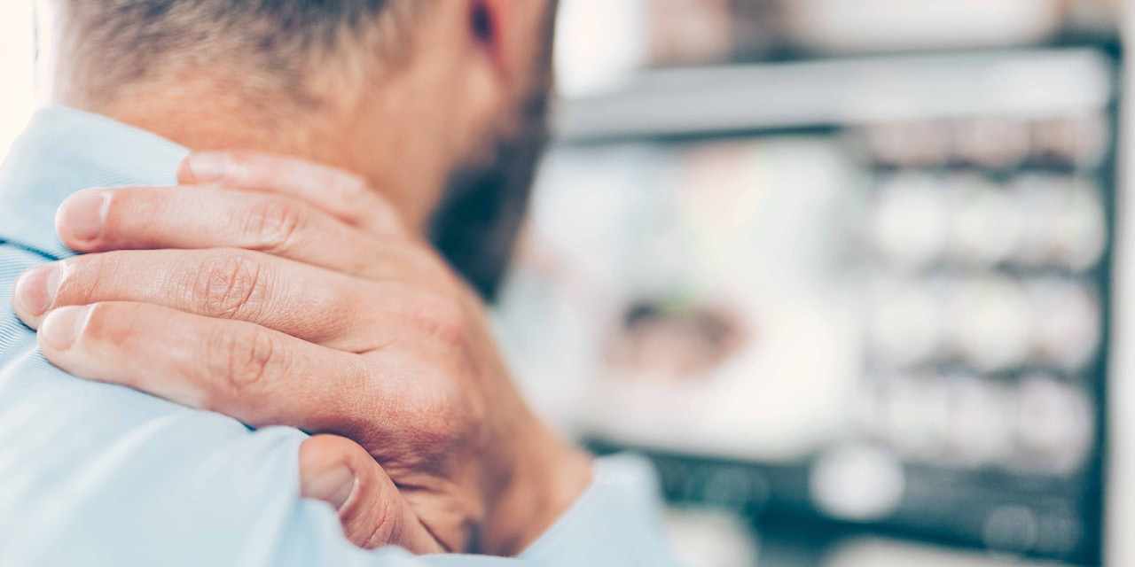 Man holding his neck in pain