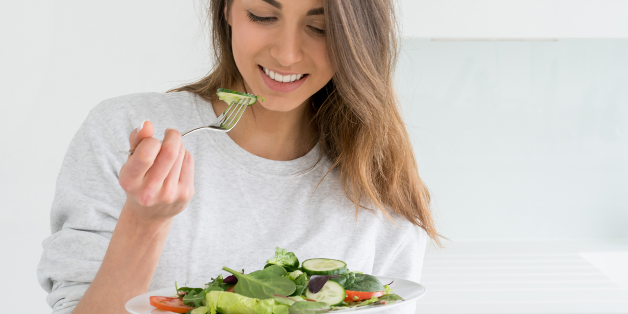 pic of lady eating a salad