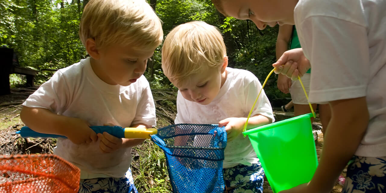 Boys playing with buckets