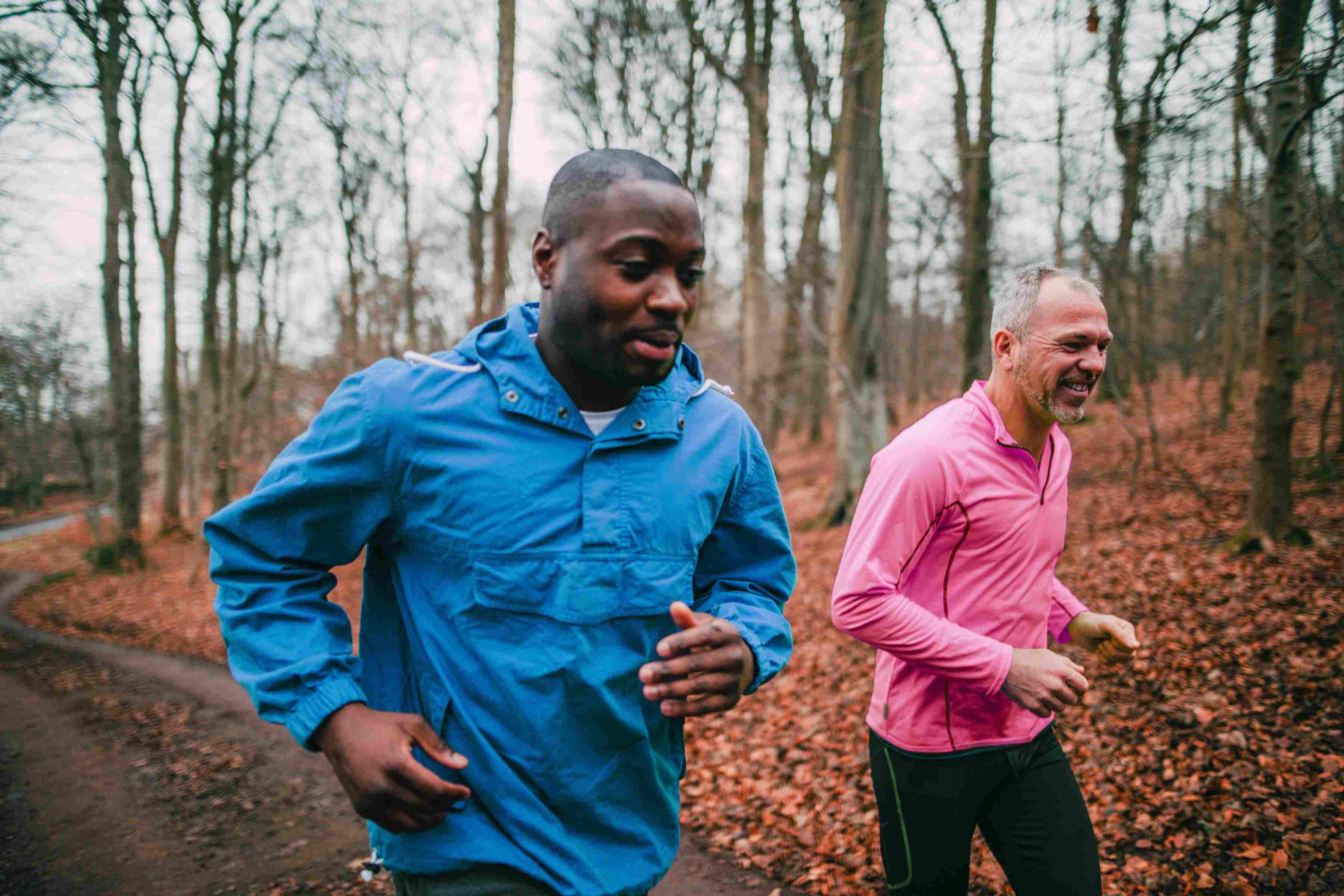 Cancer Care men running in woods
