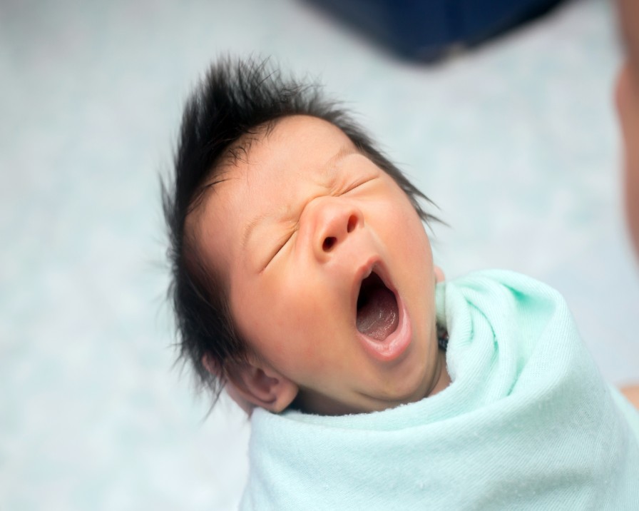 yawning-swaddled-baby new born